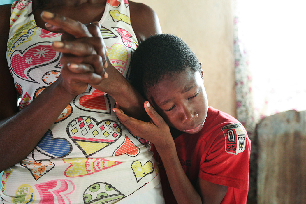 “I would like for them to achieve their hearts' desires,” said Cassandra, in Jamaica, as her son leaned in to hug her.