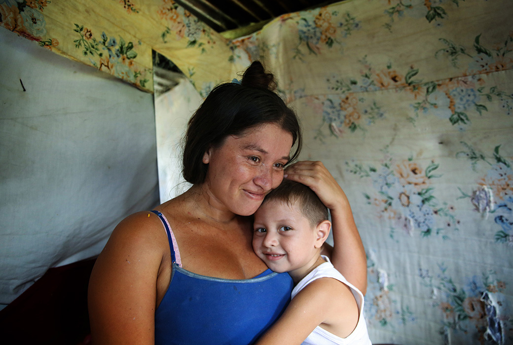 "My kids are a gift that God gave me," said Leidy in Honduras as she hugged her child who has Zika. "I would die myself if God would take one from me. I asked God to heal Elias and not take him away from me."