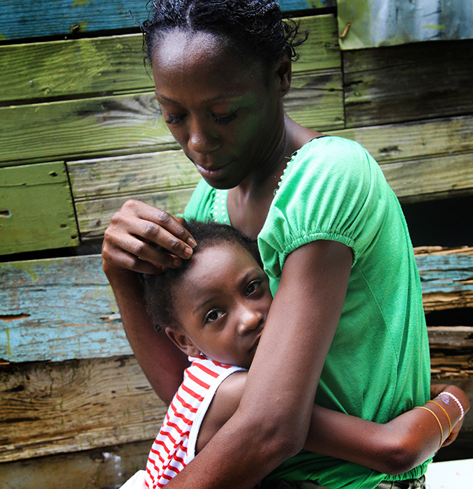 Shanika, in Jamaica, prays for her children. “I ask God to help them so life can be better."