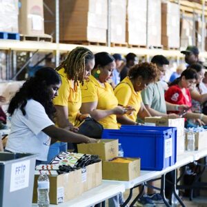 More than 100 volunteers filled 3,500 backpacks with school supplies for children in FFTP’s Angels Of Hope child sponsorship program. Photo/FFTP