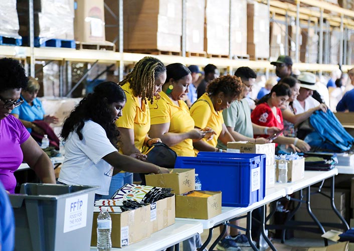 More than 100 volunteers filled 3,500 backpacks with school supplies for children in FFTP’s Angels Of Hope child sponsorship program. Photo/FFTP