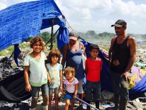 When we first met them, Maria's family was living under a tarp at a garbage dump.