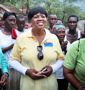 Pastor Jolinda Wade meets the residents of Manneville, Haiti, where Food For The Poor has begun building new concrete block homes for the neediest families.