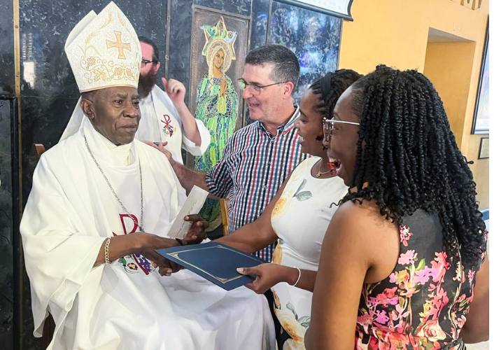 Members of FFTP Jamaica congratulate Bishop Burchell