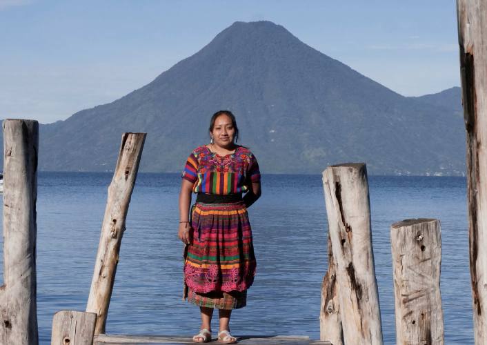 Woman from Guatemala poses in front of scenic view in her country part of fftp and mercado global partnership