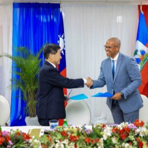 Ambassador to Haiti for the Republic of China (Taiwan), center, shakes hands with Food For the Poor-Haiti CEO announcing the FFTP Taiwan agreement