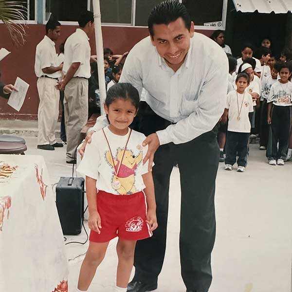 Andrea Delgado with her uncle at her school
