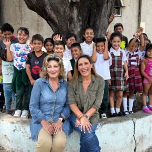 Angels Among Us hosts Angélica María and Angélica Vale sit in front of children who have been helped by Food For The Poor