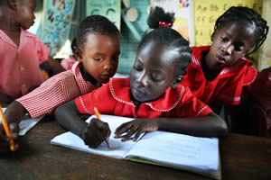 Children concentrate on their studies at a school in Jamaica supported by Food For The Poor donors.