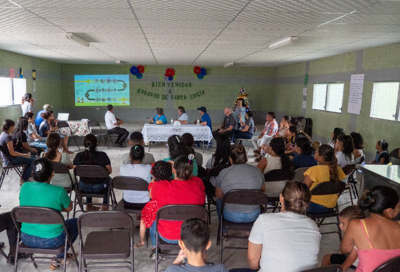 Members of the Bosque de Santa Lucia community meet to discuss future projects