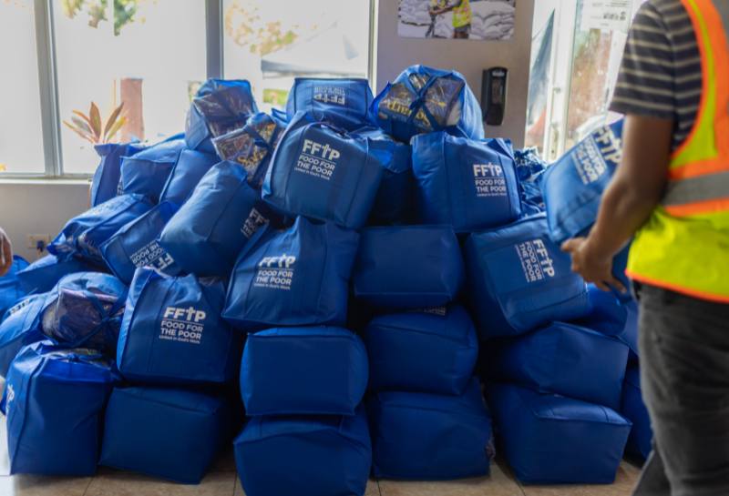 A large pile of disaster kits being prepared