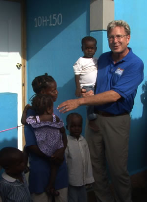 Don Moen helped Durona Previl and her family move into a new Food For The Poor home in Cap-Haitien, Haiti.
