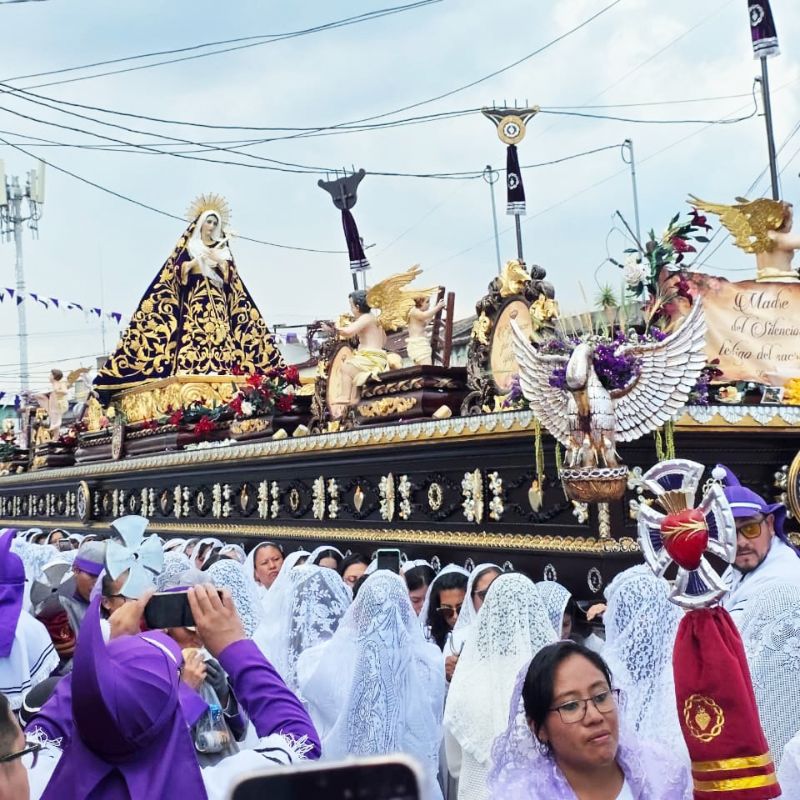women dressed in white in a religious procession during Holy Week