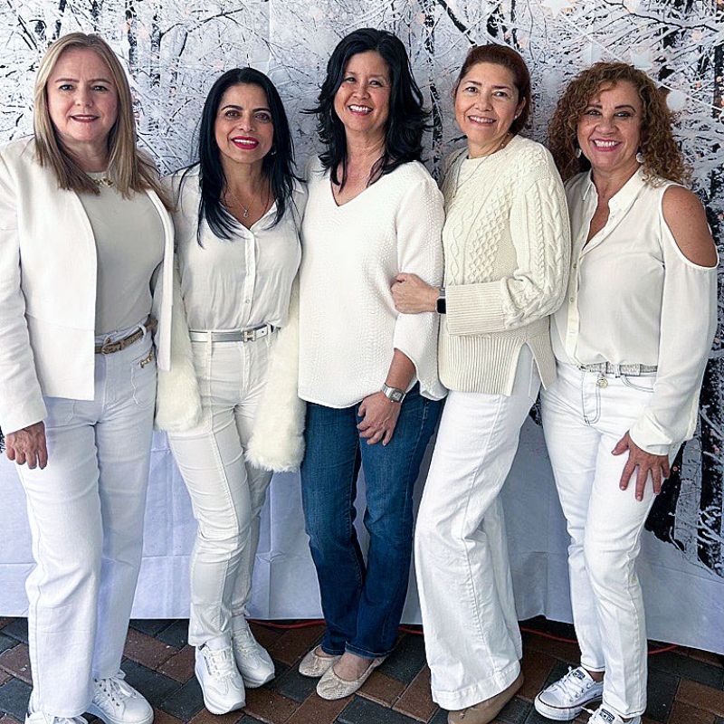 5 women dressed in white