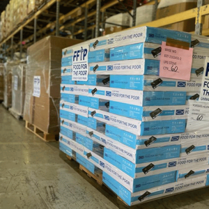 Pallets of portable stoves and other essential items are stacked in FFTP's warehouse.