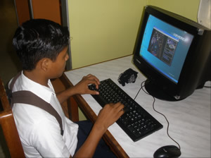 This student in Managua, Nicaragua, is eager to learn how to use the computer, so he will have technical skills to offer his future employer.