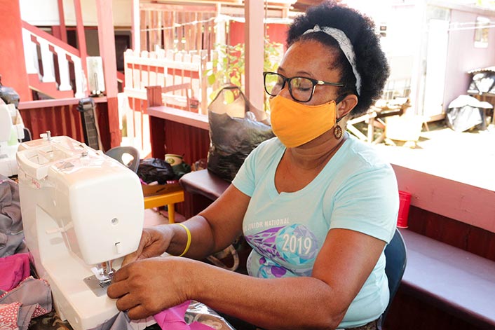Guyana - Woman sewing