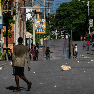 Protesters attempt to block off an area during a protest against fuel price hikes in Haiti. (AP Photo/Odelyn Joseph)