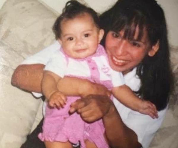 Ana Duarte as a baby on her mother's lap