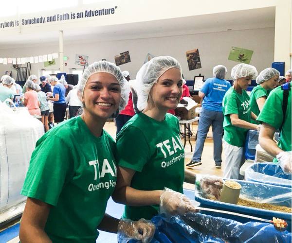 Ana Duarte and her best friend pack food kits for FFTP partner Feed My Starving Children