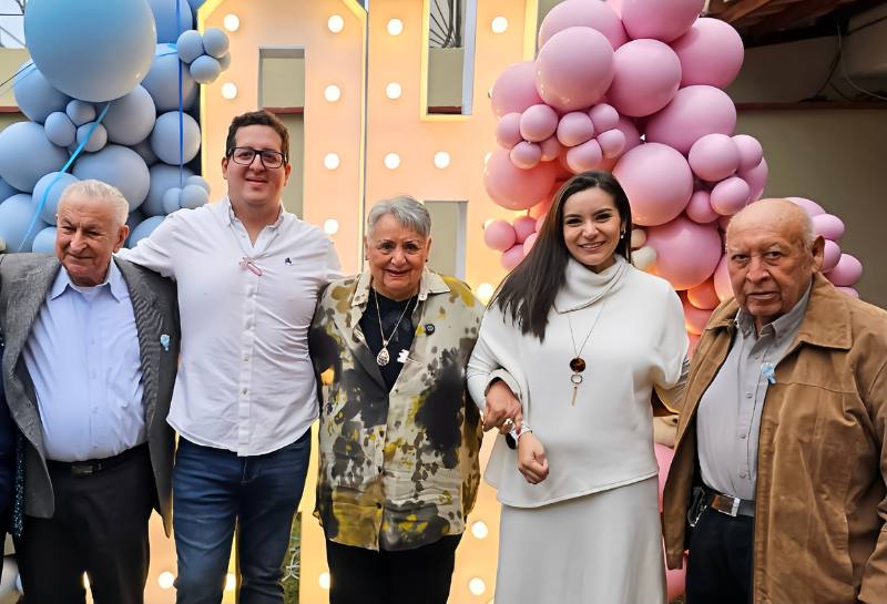 Maria Fernanda Rios, her husband, and grandparents at her baby's gender reveal party