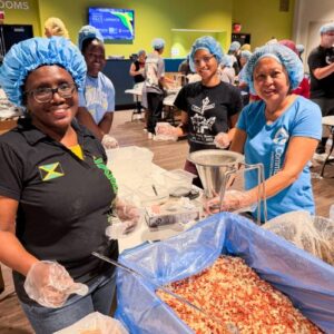a group of volunteers smile at Join the Pack Jamaica