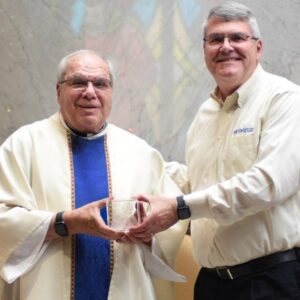 FFTP president hands Cornerstone award to Nativity Catholic Church Reverend