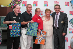 Food For The Poor Executive Director Angel Aloma, far right, thanks Office Depot Foundation staff and President Mary Wong, to left of Aloma, at the Sackpack Event on Friday, Aug. 1, at a Fort Lauderdale Office Depot store.