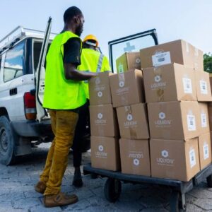 A warehouse worker unloads boxes of Liquid IV in Haiti FFTP expands partnership with Liquid I.V.