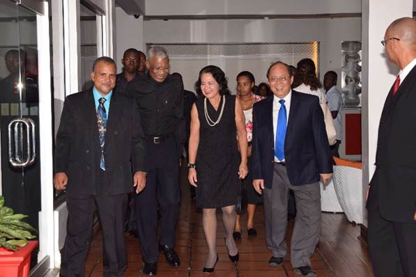Guyana President David Granger, second from left in all black, at FFP-Guyana's recent annual fundraising event. 