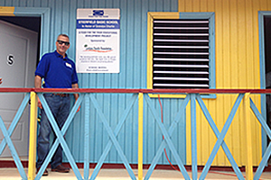 Jeff Levitetz, President of The Levitetz Family Foundation, proudly stands in front of the new Steerfield Basic School in Honor of Grandpa Charlie. The school was funded by the Levitetz Family Foundation and was built by Food For The Poor in the rural community of Steerfield, St. Ann, Jamaica. For more than a decade, dozens of 3- to 6 year-olds had to attend school in the town's community center.
