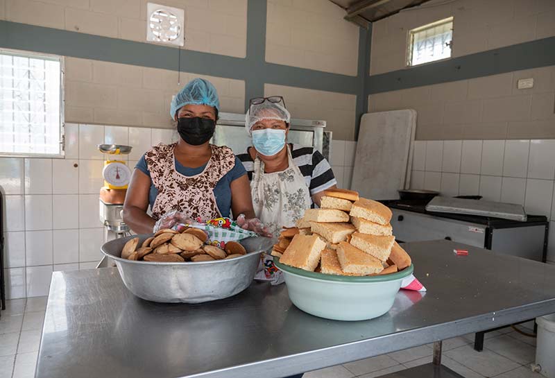 Two women take part in a bakery sustainable development project.