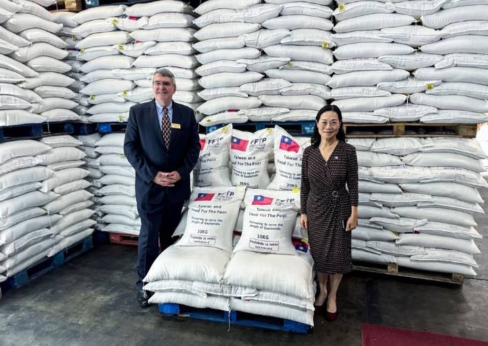 FFTP President stands with Taiwan's Ambassador to Guatemala as Taiwan donates rice to FFTP's Guatemala partners