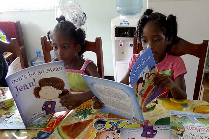 Trinidad - Two girls reading books