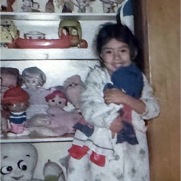 vivian borja as a child holding her stuffed animal