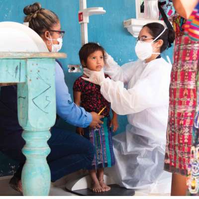 Guatemalan girl has her height measured by doctors to evaluate child malnutrition